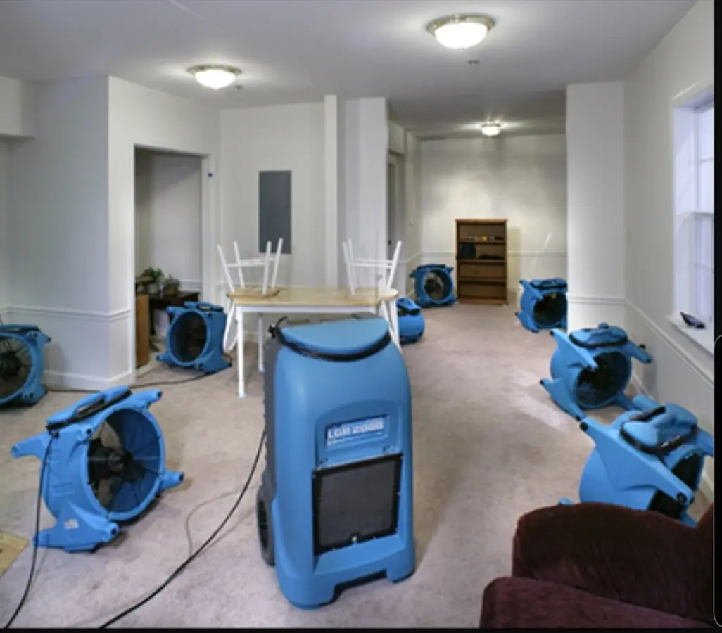 Air movers and dehumidifier setup for Water Damage Restoration in Carroll